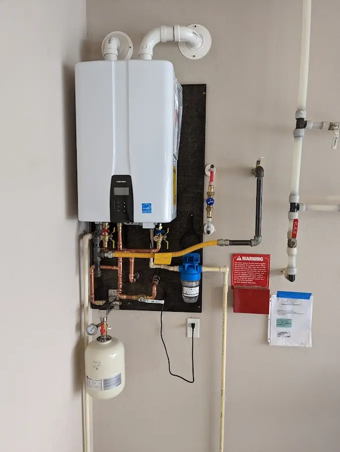 Professional plumber installing copper piping in a Waco home